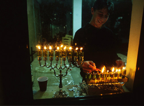 Israel Hanukkah feast of lights religious Jew lights candles