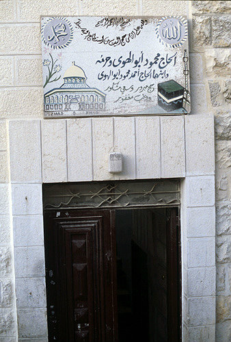 Israel, Jerusalem, signs painted over doorway of a house whose owner has been to Mecca
