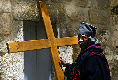 Ethiopian priest with cross, Church of the Holy Sepulchre, Good Friday procession, Jerusalem, Israel