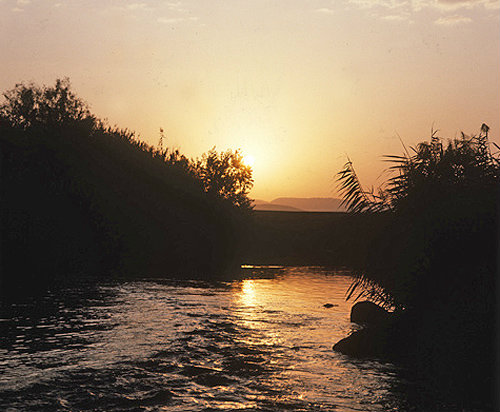 Israel, the river Jordan south of Galilee at sunrise