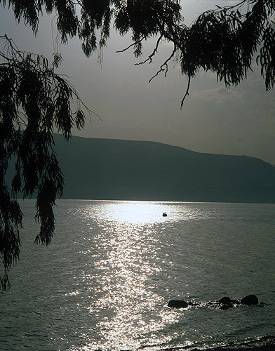 Israel, the Sea of Galilee and a fishing boat at sunrise