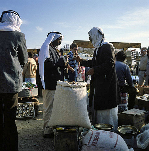 Israel, Beersheva, market, Arabs bargaining over a sack of almonds