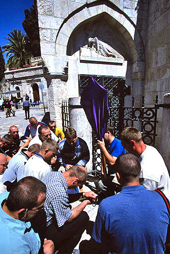 Israel, Jerusalem, Via Dolorosa, Good Friday Procession, Polish Roman Catholics pray at the third station of the cross