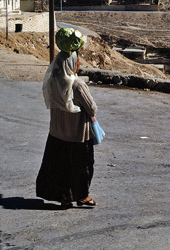 Israel, Arab woman carrying her shopping on her head
