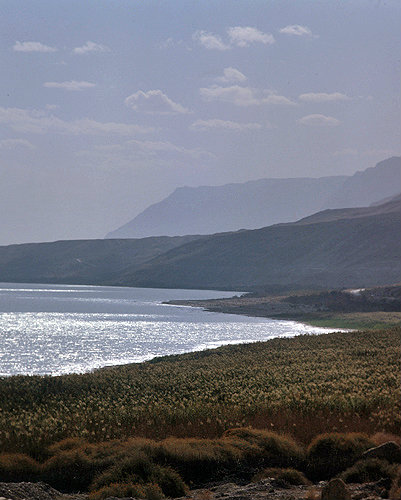 Israel, the Dead Sea and the Judean Hills, sun glinting on the water