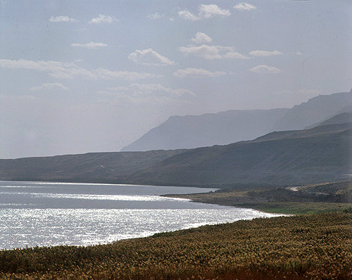 Israel, the Dead Sea and  Judean Hills against the sun