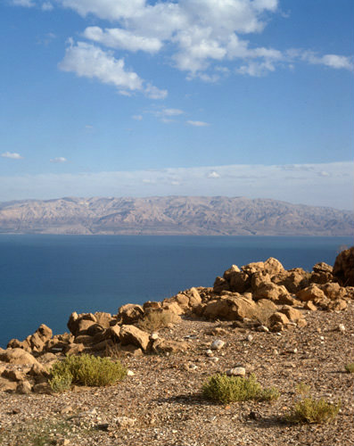 Israel, Hills of Moab and Dead Sea over rocks