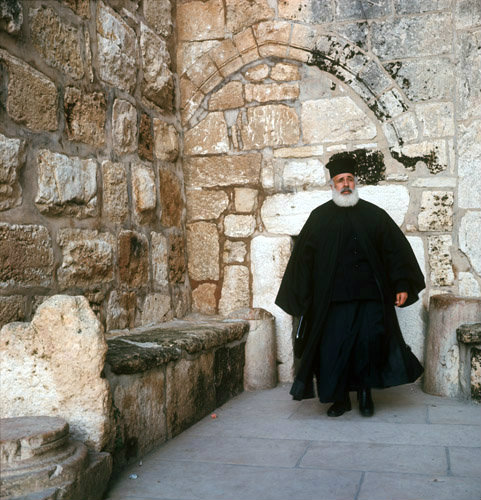 Israel, Bethlehem, Greek Orthodox Priest coming out of the Church of The Nativity