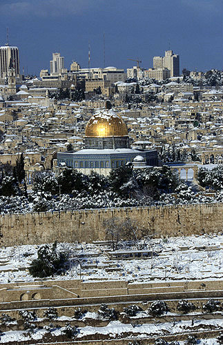 Israel, Jerusalem, Old City view after snow storm, top of the Dome of the Rock covered with snow