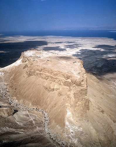 Israel, Masada, ancient fortification on the eastern edge of the Judean desert, aerial long shot from south south west with the Dead Sea beyond