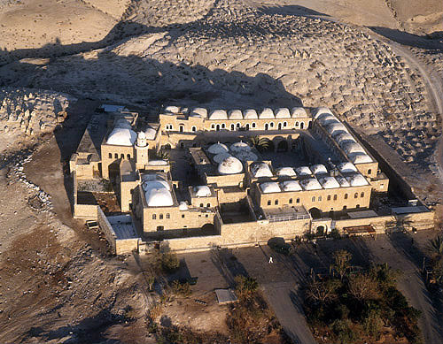 Israel, Nebi Musa, founded 13th century, extended 15th century, restored 19th century, Islamic mosque, surrounded by Bedouin burial ground, Judean desert, aerial view