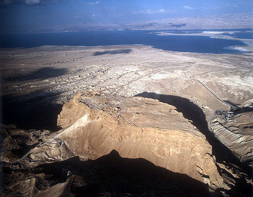 Israel, Masada, ancient fortification on the eastern edge of the Judean desert, aerial view of Roman ramp from west south west with the Dead Sea beyond