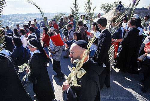 Israel, Jerusalem, Palm Sunday procession moves down the Mount of Olives  to the Old City