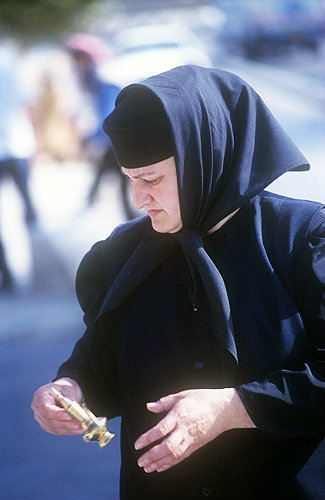 Russian Orthodox nun shopping on the Mount of Olives Jerusalem, Israel
