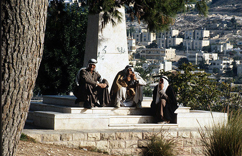 Israel, Jerusalem, three Arab men passing the time of day