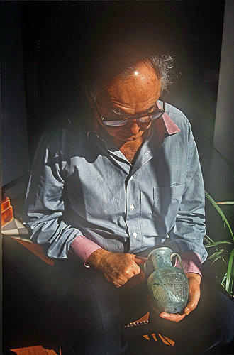 Shlomo Moussaieff holding a first century AD glass amphora signed by Ennion, dug up inside Jerusalem city walls, Israel