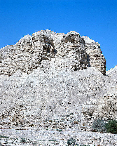 Qumran caves where the Dead Sea Scrolls were found in 1947, seen from wadi, aerial, Israel