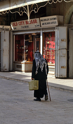 Israel, Jerusalem, an old Arab man with shopping basket in the Old City