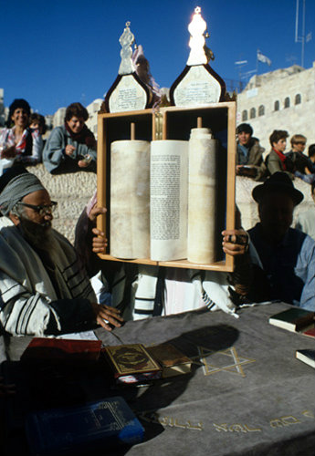 Israel Jerusalem Sephardic Jew raising the Torah  with a Rabbi at a Bar Mitzvah ceremony