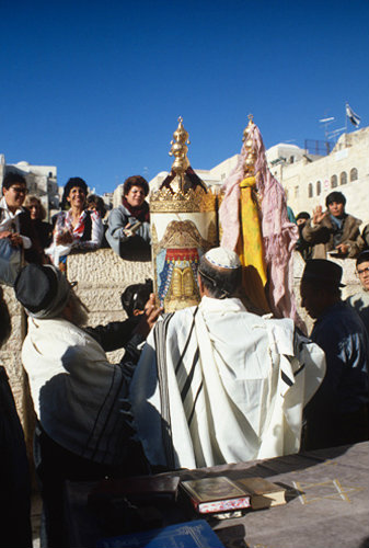 Israel Jerusalem Sephardic Rabbi and man raising the Torah at a Bar Mitzvah ceremony