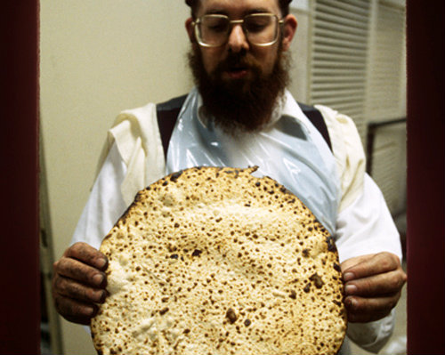 Israel Jerusalem Ultra Orthodox Jew holding up a Matza