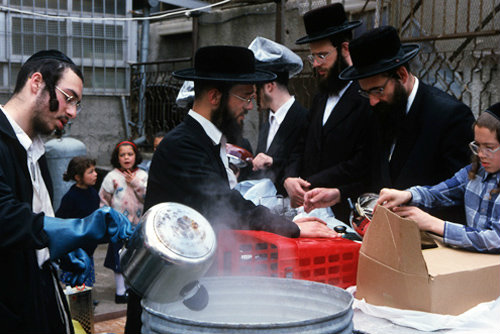 Israel Jerusalem Ultra-Orthodox Jews boil utensils to make them Kosher for Pesach  Passover Festival
