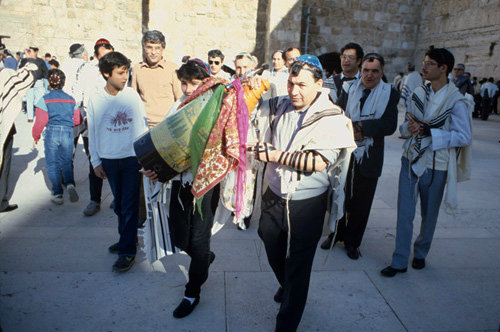 Israel Jerusalem Sephardic Rabbi with  boy carrying the Torah at his Bar mitzvah ceremony