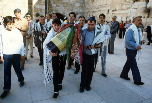 Israel Jerusalem Sephardic Rabbi with boy carring the Torah at his Bar mitzvah ceremony