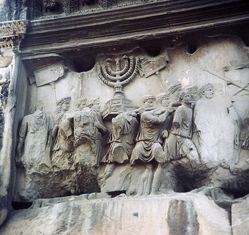 Romans carrying the menorah captured from Jerusalem, marble relief, Arch of Titus, circa 82 AD, Roman Forum, Rome, Italy