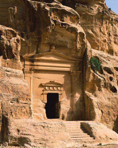 Carved façade at entrance to possible place where traders stayed, Siq al-Barid (cold gorge) Ist century AD at Beida, near Petra, Jordan
