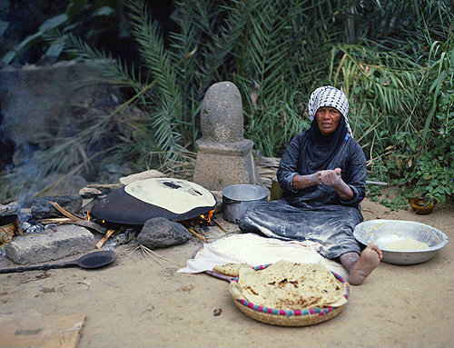 Bedouin woman making unleavened bread (shrak), Jordan