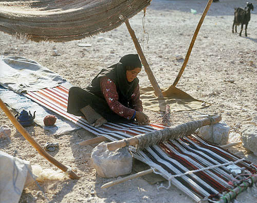 Bdoul Bedouin woman weaving rug near Petra, Jordan