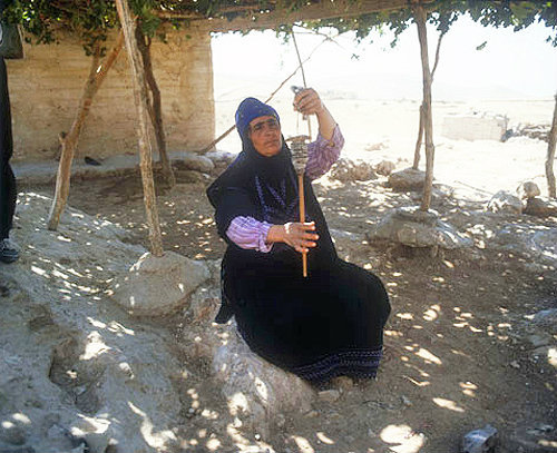Bedouin woman spinning wool, Jordan
