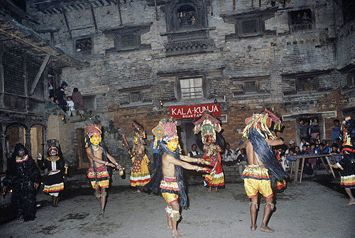 Masked dancers in Bhotebahal courtyard, Kathmandu, Nepal