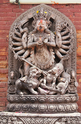 Figure of Durga, "the invincible", slayer of the Buffalo Demon, on the Lion Gate, Durbar Square, Bhaktapur, Nepal