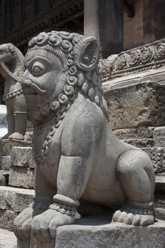 One of a pair of man-headed lions on steps to Siddhi Lakshmi Temple, seventeenth century, constructed of stone, Durbar Square, Bhaktapur, Nepal