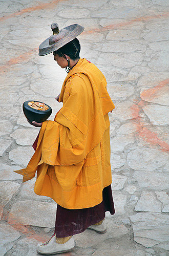 Saffron-robed participant in Tiji Festival, Lomanthang, Upper Mustang, Nepal