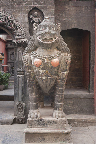 Animal figure guarding entrance to shrine, Durbar Square, Patan, Nepal