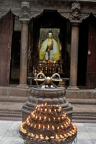 Ghee candles burning in front of Indra