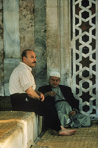 Syria, Damascus, two men sitting outside the Tekkiye Mosque