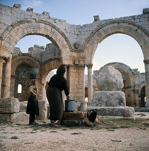 Syria,  Qalaat Semaan, women drawing water near Saint Simeons pillar in the monastery