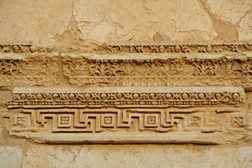 Detail of carving of Greek key pattern and bead and reel pattern on funerary temple (late second century AD) at north west end of colonnaded street, Palmyra, Syria