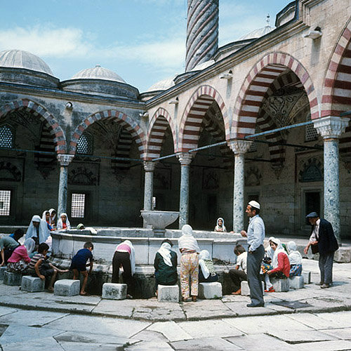 Young Turks at ablutions fountain, Uc Serefeli Mosque, Edirne, Turkey