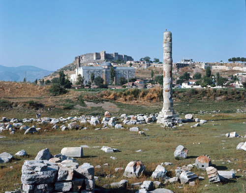 Turkey Ephesus the remains of the Temple of Artemis and behind is the Isa Bey mosque and the citadel