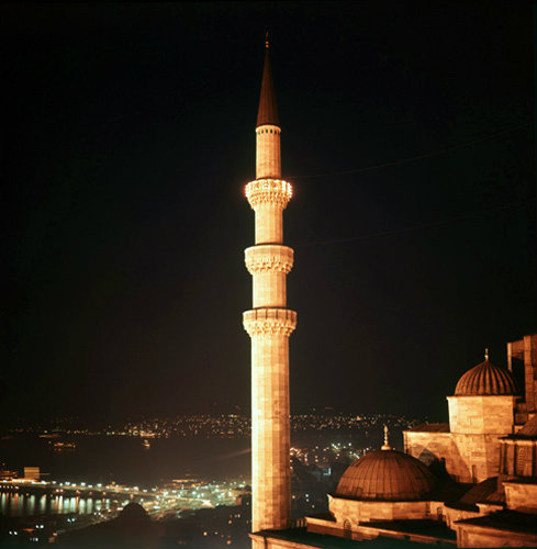 Turkey Istanbul illuminated minaret of the Suleymaniye Mosque and beyond the Golden Horn and the Bosphorus