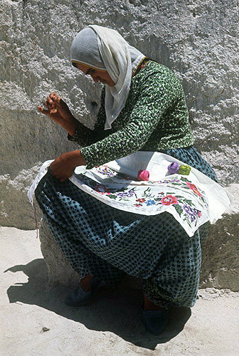 Girl doing embroidery, Macan, Cappadocia, Turkey