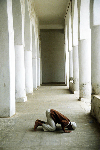 Young men praying inside Great Mosque, Al Janad, Yemen