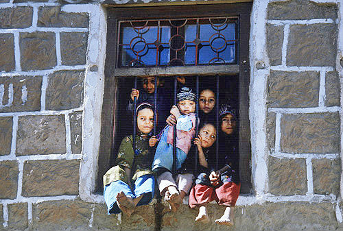 Children in window, Jibla, Yemen
