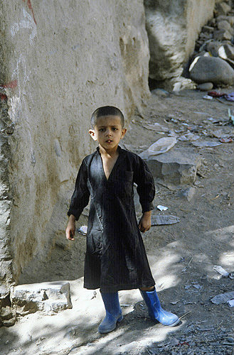 Boy in blue wellies, Jibla, Yemen