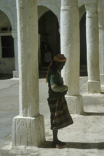 Man praying at twelfth century Great Mosque, Jibla, Yemen